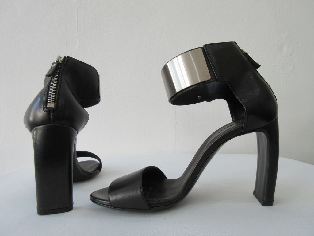 Vic Mate Metal Shin Heel. Product Number 1L5526D.L90L550101 Sandalo Alcazar 101 Black, 9.5cm leather heel. 100% Leather, Made in Italy