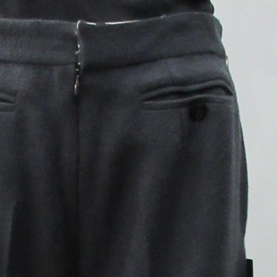 110112 Tailored Touser. Deep Grey Wool Crepe flowing with flared hem, Reverse pocket details on front. Size 8, Inseam 85cm, Outseam 106cm, 100% Wool, Contrast: 100% Cotton, Lining: 100% Rayon, Made in England