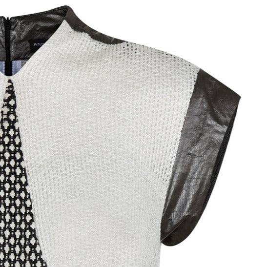 Swing Dress. Mixed array of black & white cross tooth with sheer chunky knit upper bodice, and grey Tyvek shoulder & arm panel. Contrast piping on front & back seams. CB length from neckpoint 96cm. 110g approximate weight. 86% Cotton, 14% Nylon. Contrast: 100% Acrylic. Lining: 100% Rayon. Dry Clean Only.Made in England