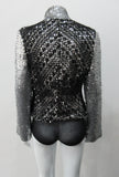 Silver Glitter Jacket with Black Crochet. Full on glittered siver colour sequin jacket with partblack crochet covered for a sporty feel. Crochet detailing unravelling/fraying in areas as done for intentional effect. CF zipper with 8.5cm high collar.  CB length 52cm. Sleeve length from side neck point 76cm. 950g approximate weight. 90% Polyester, 5% Elastine, 5% Metallic Contrast: 100% Cotton. Lining: 100% Polyester. Dry Clean Only. Made in England