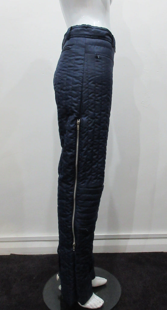 Navy blue padded trousers in 80's parachute inspired design. Large metal zippers on side seam plus invisible zippers on knee pocket panel seams. Size 8