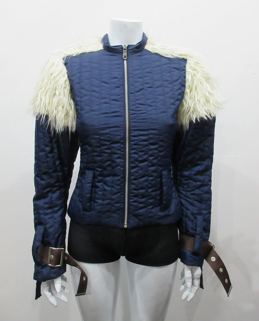 Navy blue padded jacket with striped stitching. Featuring faux Mongolian fur around sleeve caps. Big belted buckles on sleeve hems. CF industrial metal zipper. Size 8