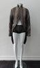 Brown Wave Cut Away Coat. Mid 19th Century military style cut-away coat in textured array of brown & brass. Slight reptile print covered with sheer stripe fabric pieces. CF cutaway and 29cm. CB slpit open back vent at hem. 2 button closure. CB length from neck point 91cm. Sleeve length from side neck point 80cm. 700g approximate weight. 75% Polyester, 25% Nylon Lining: 100% Rayon. Dry Clean Only. Made in Canada