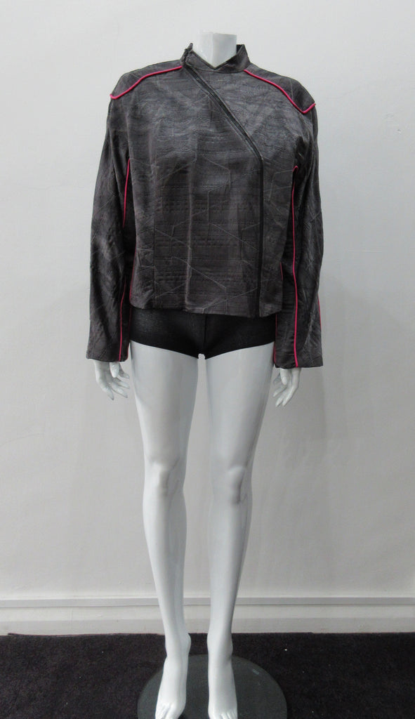 Side Zip Jacket. Assymetrical side front zip jacket featuring abstract stitching incorporated into the fabric for a geometric feel. Rich deep grey colour with pink piping accents on shoulder and sleeve panels. Fully lined. CB length 53cm. Sleeve length from side neck point 75cm. 400g approximate weight. 29% Nylon, 22% Viscose, 28% Cotton, 12% Linen, 2% Polyester. Lining: 100% Rayon. Dry Clean Only. Made in Canada