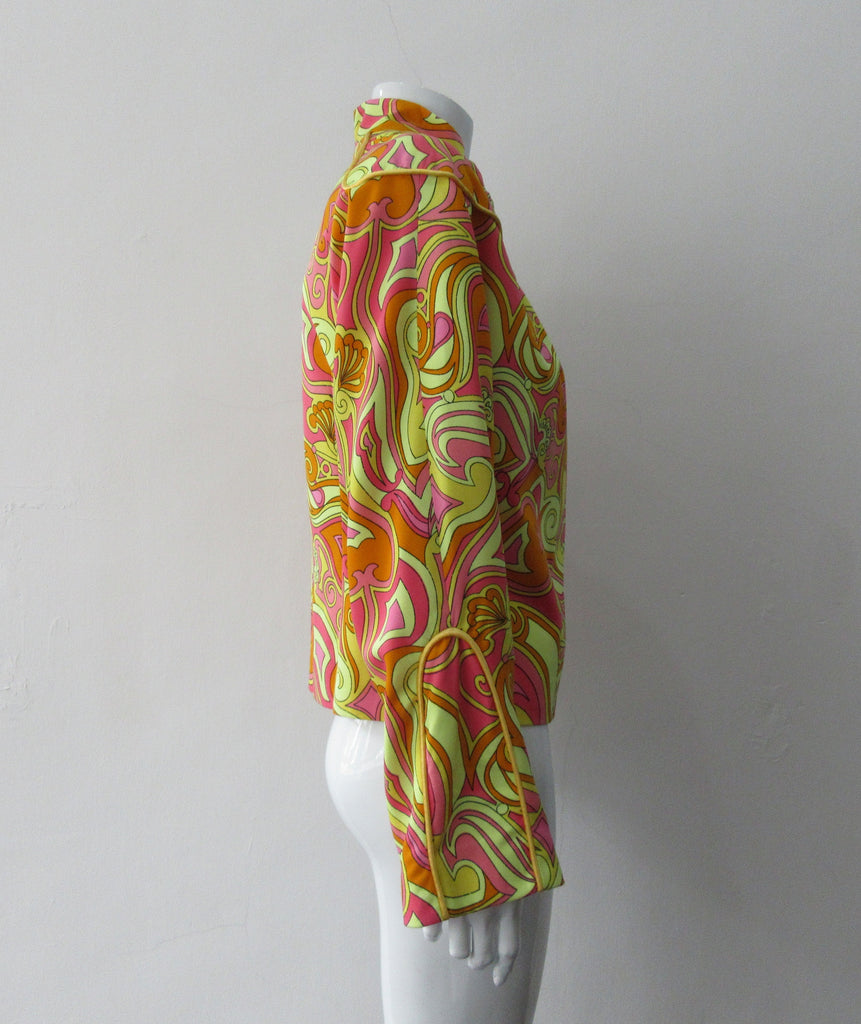 Bright Yellow Print Jacket. Bright loose fitting zippered jacket with 60's style yellow, pink and orange design. Chinese style piping trim accent in yellow satin piping.  Fully lined. 100% Viscose. Lining: 100% Rayon, Dry Clean Only. Made in Canada, 240g approximate weight