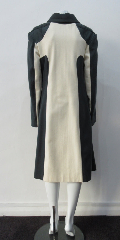 Full length coat featuring charcoal and white contrast panels. 5 covered buttons on centre front.