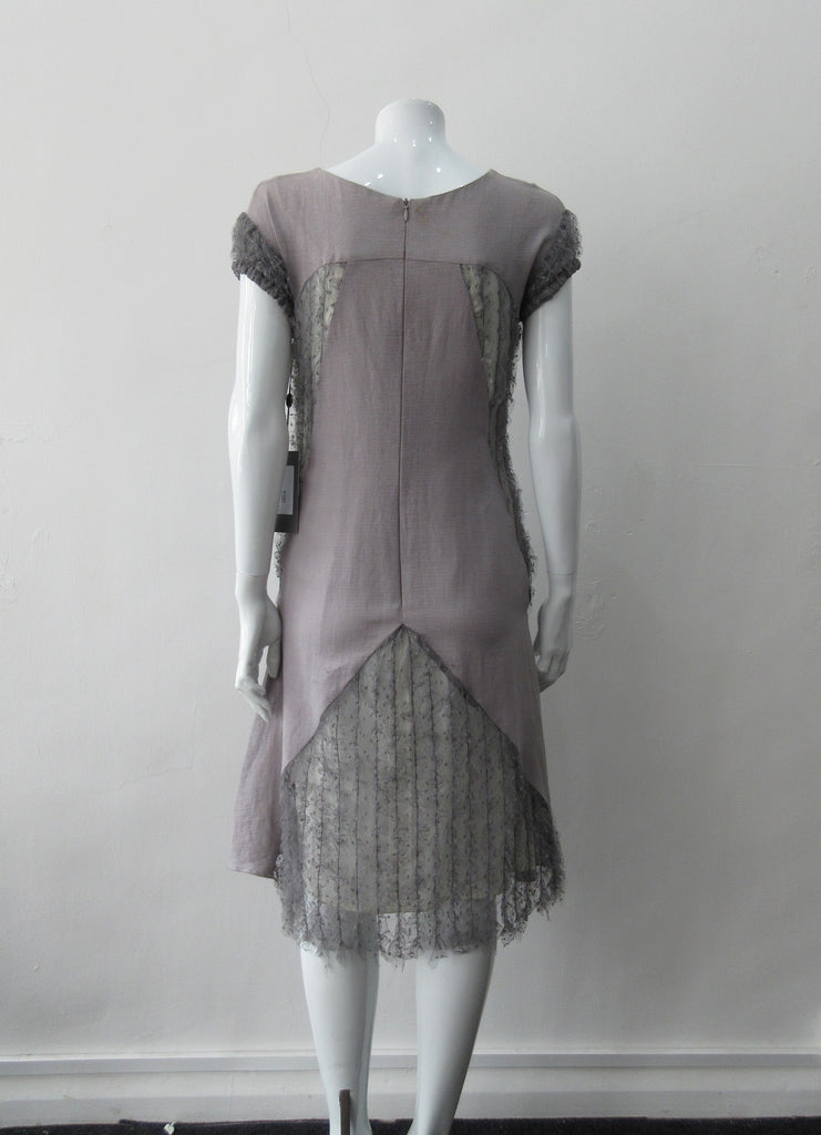 A Dress, Blue-Grey A-line dress with custom built textured netting panels. 65% Linen, 35% Cotton. Contrast: 98% Polyamide, 2% Polyester Lining: 100% Rayon. Dry Clean Only. 250g approximate weight. Made in Croatia