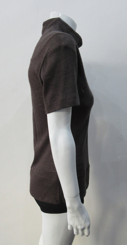 T-Shirt style with short sleeves featuring curved panel parallel to neckline and soft dropped round collar. Soft wool fine knit in rich brown colour. Size 8