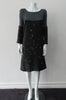 Quad Pleat Dress. Coffee brown chinky knit dress with beige fuzz balls knitted in with taupe jersey upper panel. 2 pleats to dress and 2 pleats towards the hem. Long sleeves. CB Length 92cm, 1.2 kg approximate weight. 100% Wool, Contrast: 100% Modal Dry Clean Only. Made in Canada