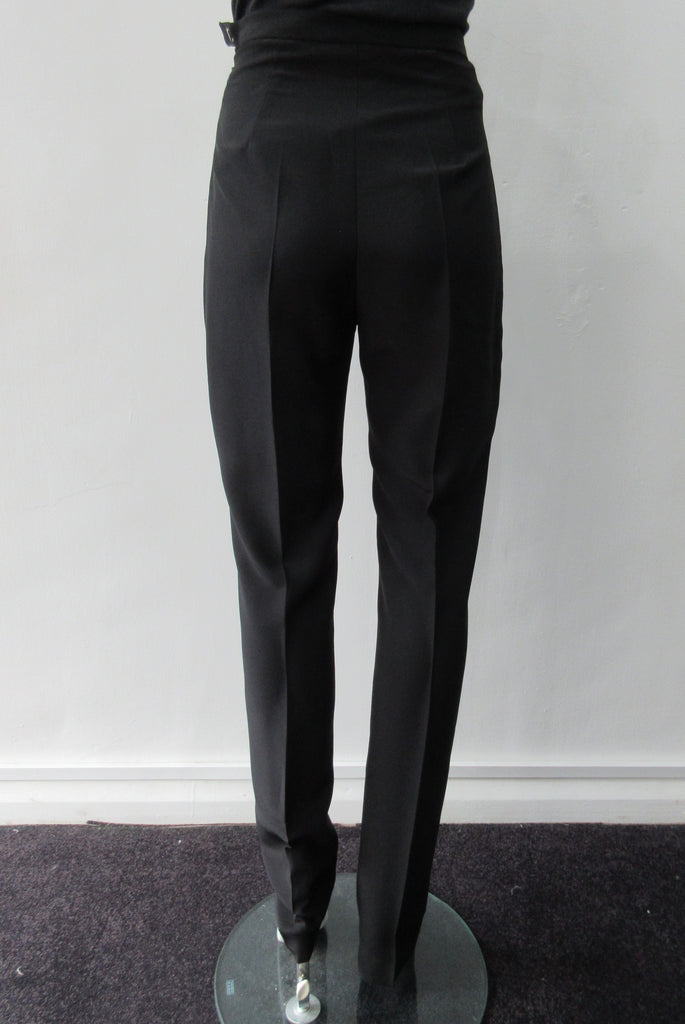 Higher waisted black trouer with tight waist and tapered hems. Contrast print inside waistband. 100% Poyester Crepe Contrast: 100% Silk Dry Clean Only. Exceptional tight fit with small raised waist, more suitable for a very slender figure. Size 6 or XS, Inseam 88cm