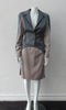 Cropped Point Sleeve Jacket. Pointed peak collared cropped style in grey with light taupe/rose contrast sleeve panels. Relaxed fit with soft raglan sleeves. Shown with matching skirt. Size 8. 100% Wool. Lining: 100% Rayon, Dry Clean Only. Made in England