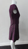 Pointed Tip Dress. Rich purple wool dress with matching floral book print contrast panels and base. Soft cap sleeve top and CB zipper. CB Length 82cm. 550g approximate weight. 100% Wool. Contrast: 100% Cotton, Lining: 100% Rayon. Dry Clean Only, Made in England