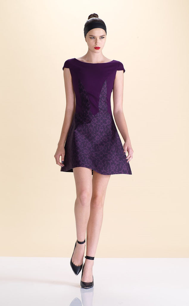 Pointed Tip Dress. Rich purple wool dress with matching floral book print contrast panels and base. Soft cap sleeve top and CB zipper. CB Length 82cm. 550g approximate weight. 100% Wool. Contrast: 100% Cotton, Lining: 100% Rayon. Dry Clean Only, Made in England