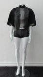 Black Crop Top. Cropped raglan sleeve top in medium weight scuba with contast charcoal colour, shiny fabric front.  Medium sleeves with charcoal shiny contrast trim on sleeve hems.  5cm high collar. CB invisible zipper. CB neck point length 57cm 350g approximate weight.  85% Polyamide, 15% Elastine. Contrast: 98% Nylon, 2% Lycra. Dry Clean Only. Made in England