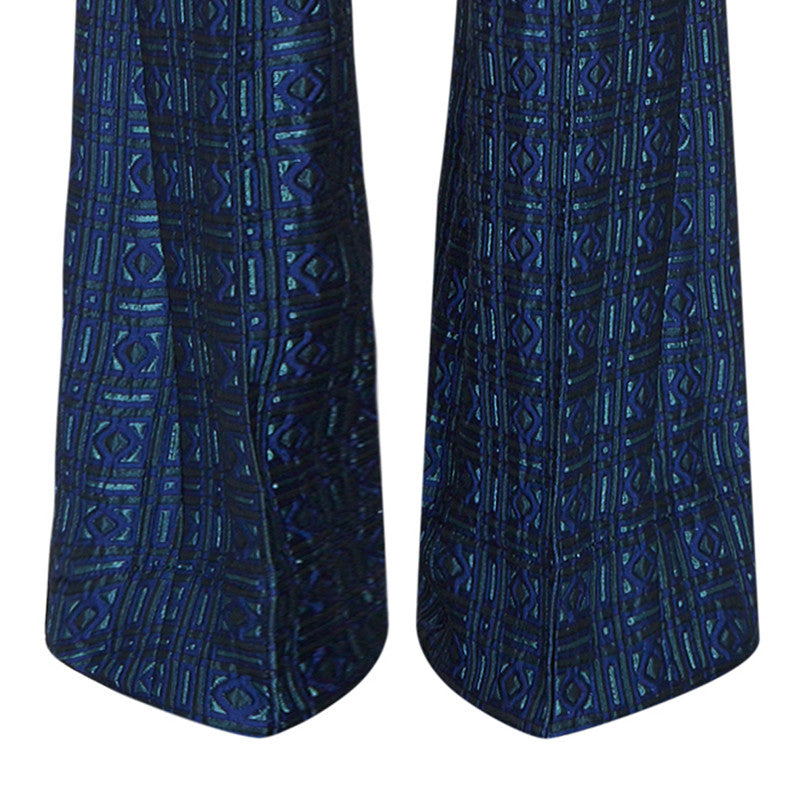 Previously worn sample. High waisted Textured Trouser features blue diamond and square geometric design. 450g approximate weight. 56% Polyester, 36% Acetate, 8% Polyamide. Lining: 100% Rayon. Dry Clean Only. Made in England
