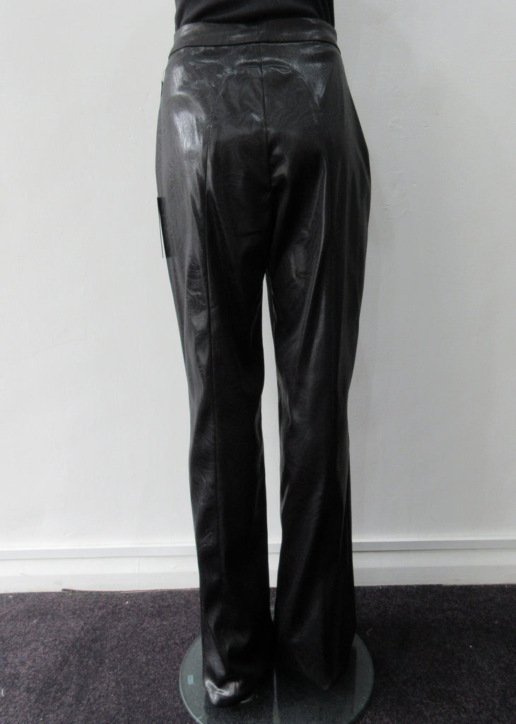Shiny PVC style looser cut trouser with curved back panel.  Extra long legs good for taller person.  In black colour.  Size 10  Inseam 86cm, Outseam 118cm  73% Acrylic, 22% Nylon, 3% Elastine Lining 100% Nylon Dry Clean Only  Made in England