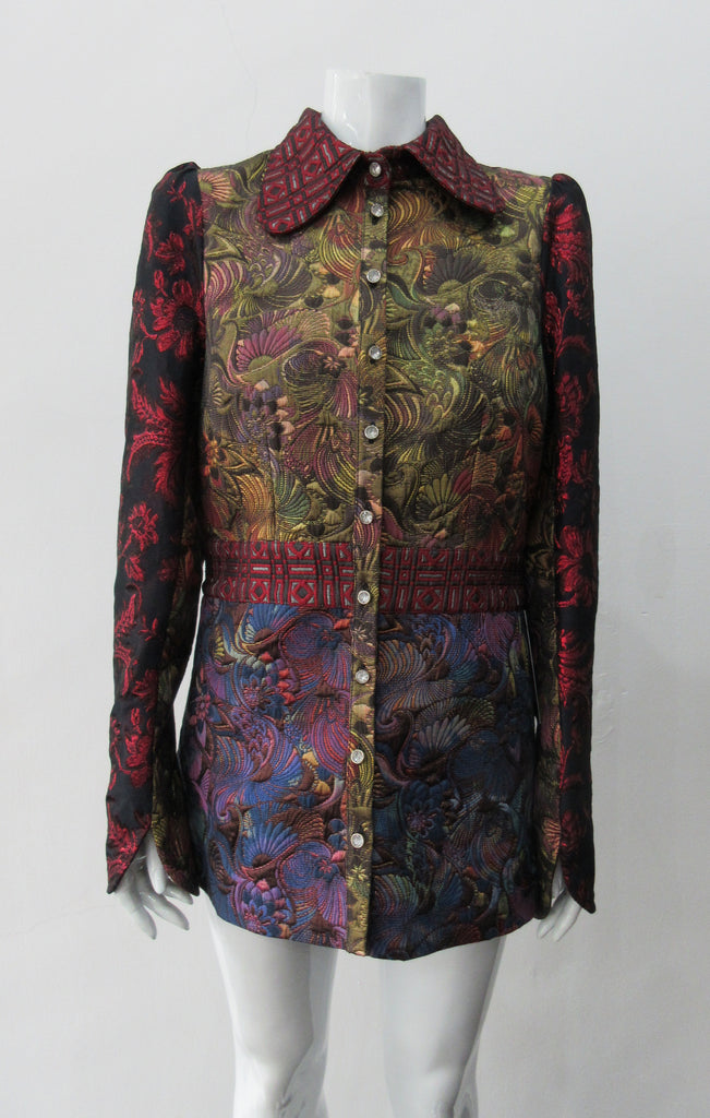 Collared Top. Multi-Combined textured fabric in brass, purlple brocade and red floral for sleeves. CF buttons in shiny quartz-like glass and large Peter Pan style collar. CB jacket length 71cm. 250g approximate weight. 65% Cotton, 35% Polyester. Contrast: 60% Acetate, 28% Polyester, 12% Polyamide. Dry Clean Only. Made in England