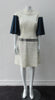 White Collared Swing Dress. Super stretch medium collared a-line dress in off white and blue pleated sleeves. In textured combination of solid and stripe with grey sequined panel across lower waist area. CB invisible zipper. CB dress length 98cm. 300g approximate weight. 46% Linen, 38% Polyester, 12% Polyamide, 4% Elastine. Contrast: 40% Polyamide, 29% Linen, 26% Polyester, 5% Elastine. Dry Clean Only. Made in England