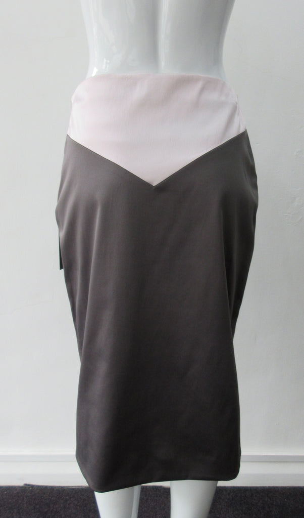 Shiny A Skirt. Chocolate Taupe coloured A-Line skirt with light, soft pink pointed panel on upper part. Stretch woven for greater ease and fit. Invisible side zip. Can be paired with 170609B Dark Spy Top. CB length 67cm. 200g approximate weight. 97% Polyester, 3% Elastine. Lining: 100% Viscose. Made in England