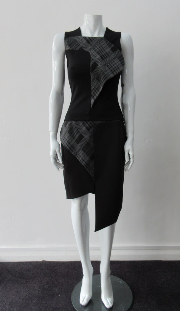 Assymetrical Plaid Front Top. Sleeveless crop top with plaid contrast panel extension can be flipped to right or left. Solid black bodice with grey tatran plaid panel. CB length 51cm, 300g approximate weight. 97% Cotton, 3% Lycra. Contrast: 63% Polyster, 33% Rayon, 4% Sapndex Lining: 100% Viscose