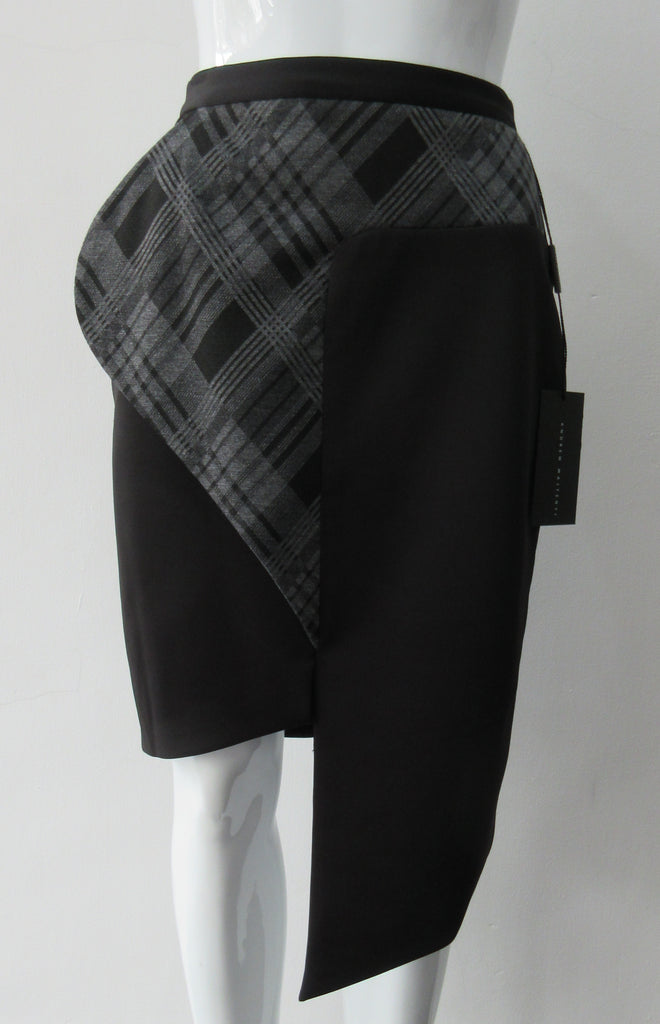 Assymetrical Plaid Front Skirt with plaid contrast panel extension can be flipped to right or left. Solid black bodice with grey tatran plaid panel. CB length from waist 96cm. 500g approximate weight. 97% Cotton, 3% Lycra. Contrast: 63% Polyster, 33% Rayon, 4% Sapndex. Lining: 100% Viscose. Made in Canada