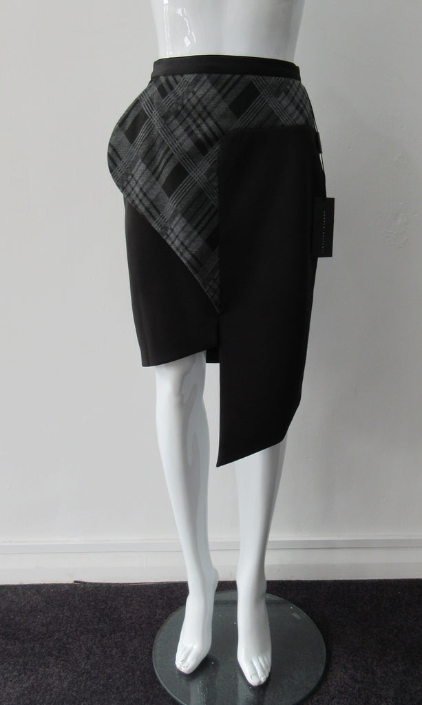 Assymetrical Plaid Front Skirt with plaid contrast panel extension can be flipped to right or left. Solid black bodice with grey tatran plaid panel. CB length from waist 96cm. 500g approximate weight. 97% Cotton, 3% Lycra. Contrast: 63% Polyster, 33% Rayon, 4% Sapndex. Lining: 100% Viscose. Made in Canada