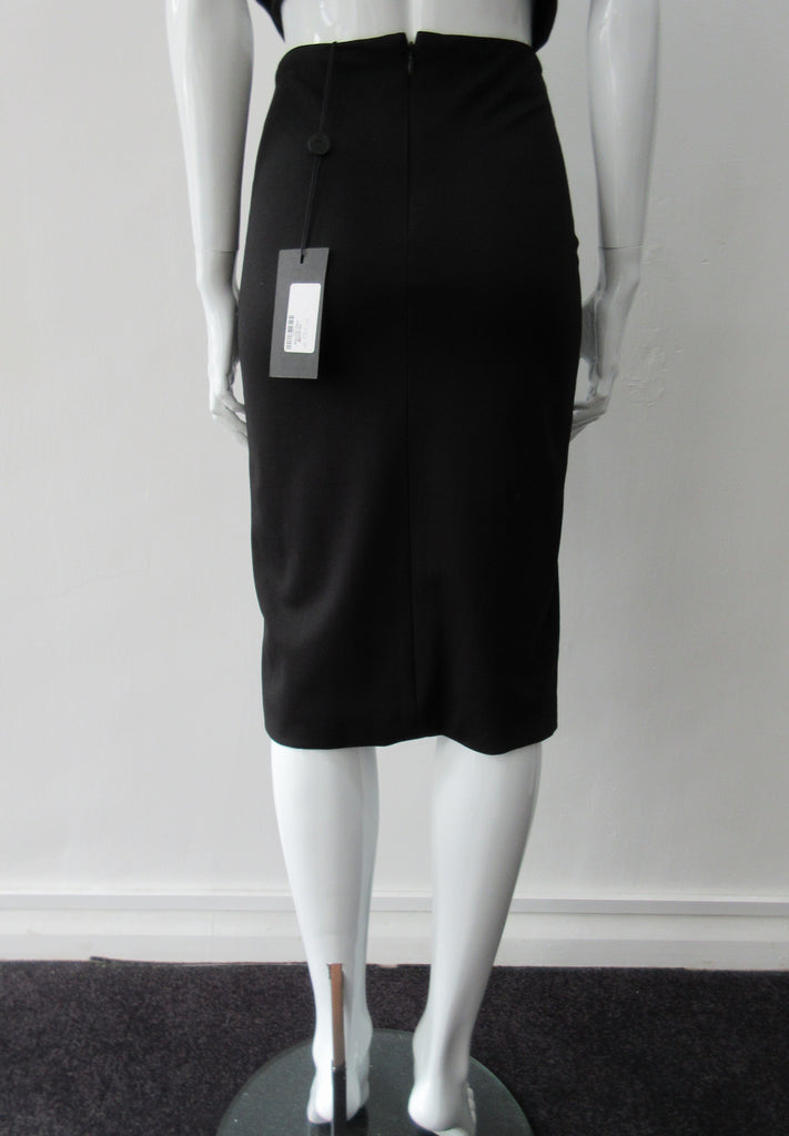 Black & White Skirt. Black fitted skirt with black & white cotton stripe contrast panel. CB length 64cm. 450g approximate weight. 97% Cotton, 3% Lycra. Contrast: 94% Cotton, 6% Polyester. Lining: 100% Viscose Dry Clean Only. Made in Canada