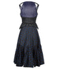 Sleevelss dress combination of blue ruched bust area with black faux leather thin peplum aspect and mid-waist panel. Gathered flounces on lower dress adds volume and greater movement. Small gap in middle of bust. 650g approximate weight. 81% Polyester, 14% Polyamide, 5% Elastine. Contrast 48% Polyester, 34% Cotton, 18% Nylon. Dry Clean Only. Made in England
