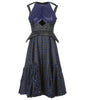 Sleevelss dress combination of blue ruched bust area with black faux leather thin peplum aspect and mid-waist panel. Gathered flounces on lower dress adds volume and greater movement. Small gap in middle of bust. 650g approximate weight. 81% Polyester, 14% Polyamide, 5% Elastine. Contrast 48% Polyester, 34% Cotton, 18% Nylon. Dry Clean Only. Made in England