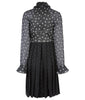 Medium length long sleeve dress featuring high ruched collar and gathered front bodice to waist panel. Sheer black with white tri-circular design. Slight fraying on collar natural part or ruching effect. Fully pleated below waist panel in solid black textured fabric. 700g approximate weight. 93% Acrylic, 7% Lycra. Contrast: 81% Polyester, 14% Polyamide, 5% Elastine. Dry Clean Only.  Made in England