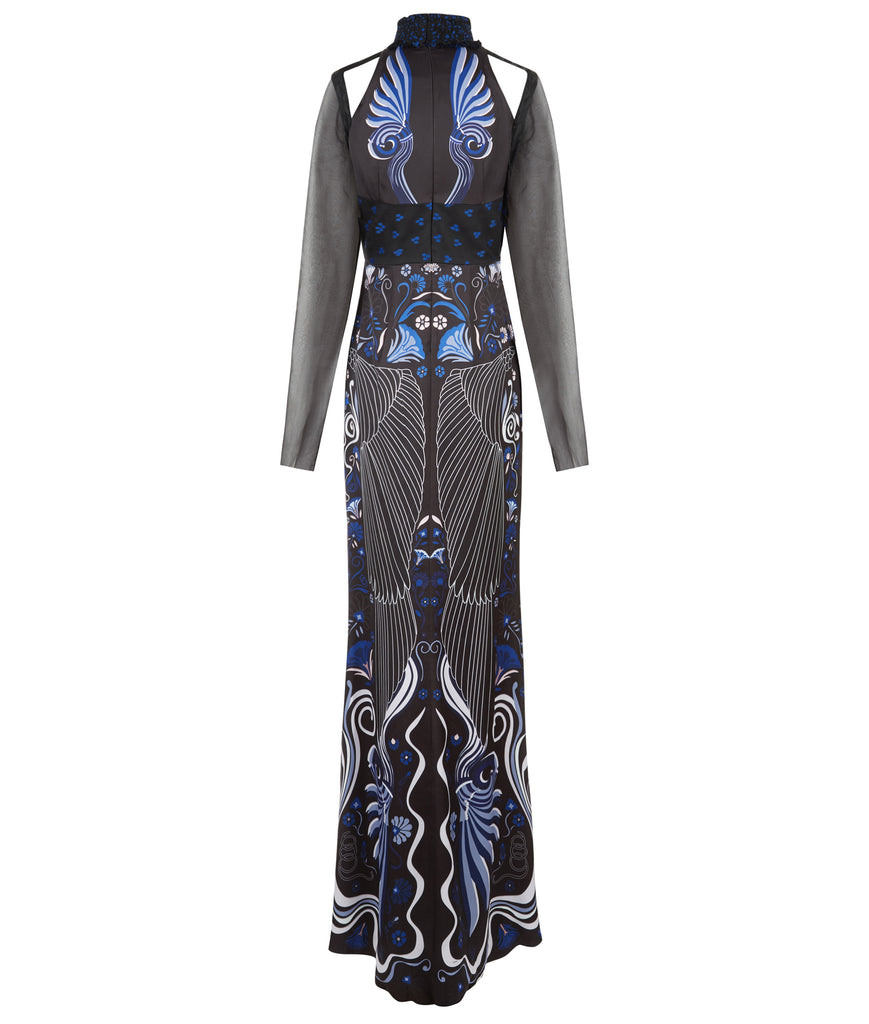 Full length multi-textured print dress featuring faux leather criss-cross paneling and black sheer sleeves. Semi-open top shoulders. Upper bodice has black with blue spotted design.