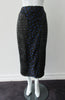 Dark Curve Front Pencil Skirt. Slightly tighter pencil-style fit skirt in sheer black with tri-blue dot design, and black faux leather textured weave design. Can be paired with 180609B Dark Gathered Top. CB length to hem 79cm. 32cm concealed vent bottom of skirt. 400g approximate weight. Fully lined. 90% Polyester, 10% Cotton. Contrast: 100% Polyester. Dry Clean Only. Made in England