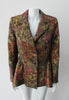 Sahara Jacket. Brass red and purlple textured brocade jacket featuring side hip gathers and 2 button front clousure. CB Length from neck point 67cm. 65% Cotton, 36% Polyester. Lining: 100% Rayon. Dry Clean Only. Made in England