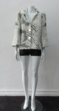White Brocade Swing Jacket. Cropped full swing white multi textured brocade jacket. Contrast light grey undertone fabric. Including 2 beautiful buttons. CB length 55cm. 68% Polyamide, 29% Wool, 5% Silk Lining: 100% Rayon. Made in England