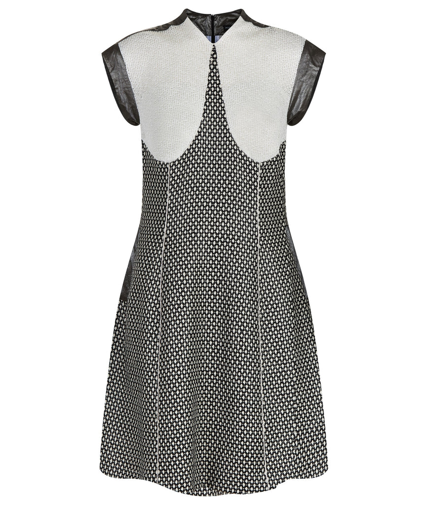 Swing Dress. Mixed array of black & white cross tooth with sheer chunky knit upper bodice, and grey Tyvek shoulder & arm panel. Contrast piping on front & back seams. CB length from neckpoint 96cm. 110g approximate weight. 86% Cotton, 14% Nylon. Contrast: 100% Acrylic. Lining: 100% Rayon. Dry Clean Only.Made in England