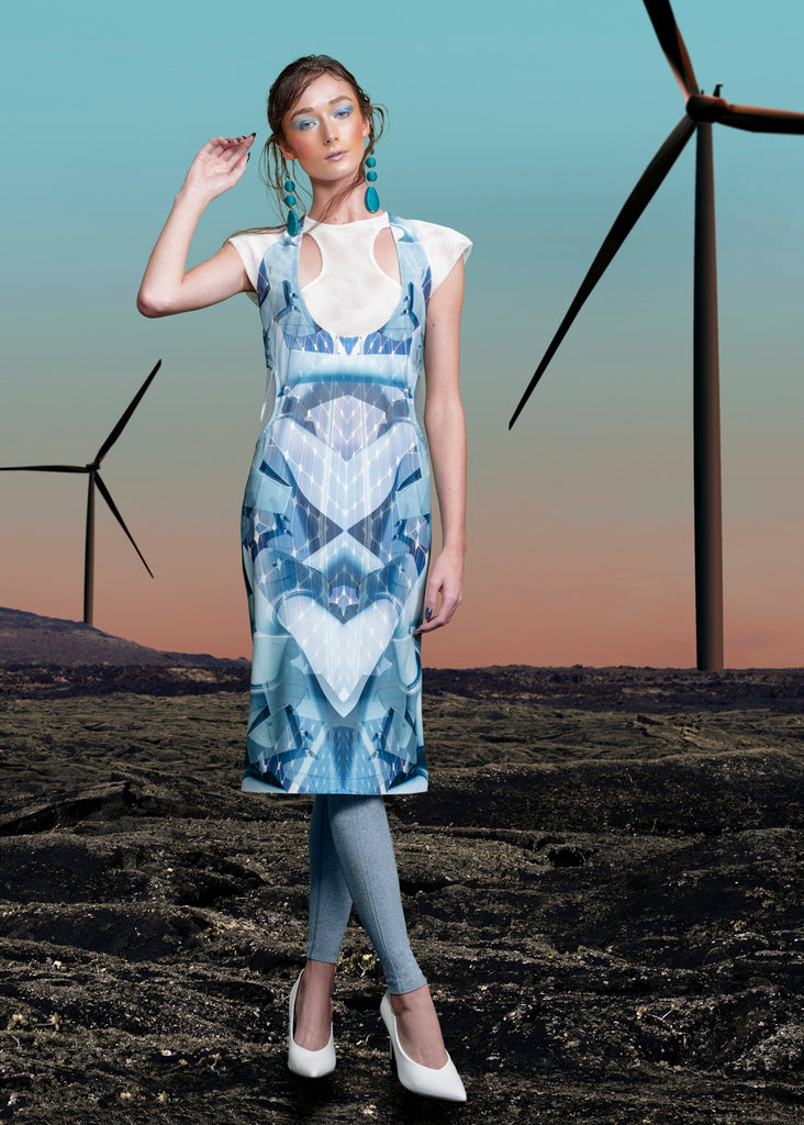 Print Round Waist Dress. Multi-blue coloured wind turbine print dress with dropped front neck, compensating with sheer white mesh on chest and shoulder tips. Turine blade style detail on side hips featuring tri-elastic trim groupings.