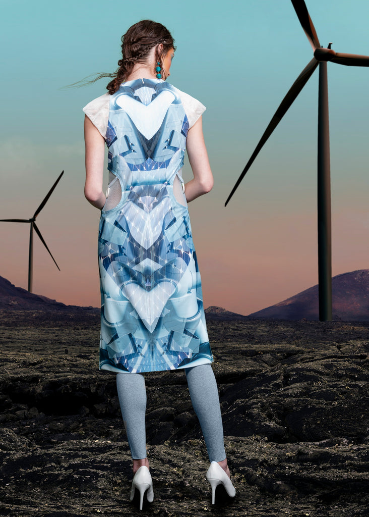 Print Round Waist Dress. Multi-blue coloured wind turbine print dress with dropped front neck, compensating with sheer white mesh on chest and shoulder tips. Turine blade style detail on side hips featuring tri-elastic trim groupings.