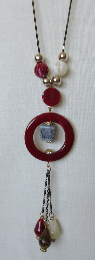 Red Ring Necklace red circle, blue stone multiple beads beige red gold close-up image photo picture