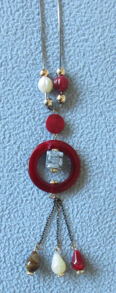Red Ring Necklace red circle, blue stone multiple beads beige red gold zoom close-up image photo picture