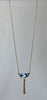Gold colour light blue white tassle necklace close-up image photo picture