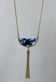 Gold colour tassled tassle dark blue white necklace close-up zoom image photo picture