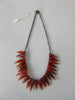 Tiger tooth pointed crystals in deep and blood orange colours. Smooth texture.