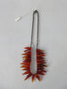 Tiger tooth pointed crystals in deep and blood orange colours. Smooth texture.
