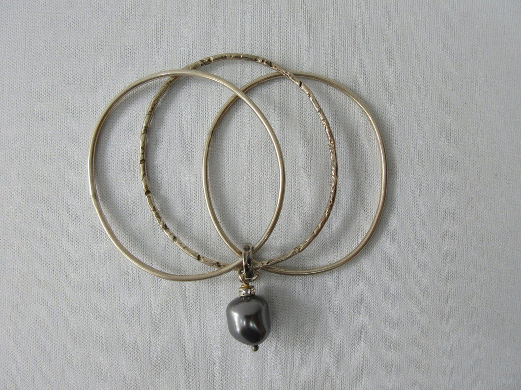 Karyn Choppik Multi 3 Ring Bracelet with Swarowski Pearl, Sterling Silver Bracelets, 1 textured. Combined and attached with Antiquated Brass ring attaching the pearl.  Size M -6.3cm inside diameter x1 Size L -6.8cm inside diameter x1, 40g approximate weight, Made in Canada