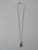 20A63 Brass Person Figure Steel Necklace  Brass person attached to stainless steel chain.  Full length when worn 25cm. 12 grams approximate weight.
