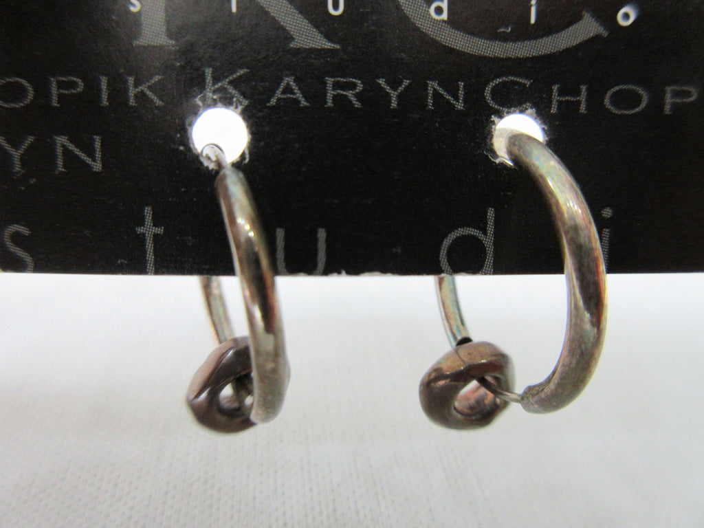 Karyn Chopik Double Ring Earring. Item Number: E124. Large ring combined with small ring. Sterling Silver, Antiquated Brass & Copper, 20g approximate weight