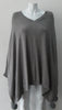 Generous cut swing poncho for greater ease and comfort. 4 fuzz balls located at corner points.  Art. 4461, 52% Viscose, 35% Modal, 8% Elastic, 5% Cashmere, Dry Clean Only, Made in Italy, CB Length 81cm approximate length.