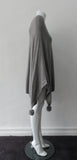 Generous cut swing poncho for greater ease and comfort. 4 fuzz balls located at corner points.  Art. 4461, 52% Viscose, 35% Modal, 8% Elastic, 5% Cashmere, Dry Clean Only, Made in Italy, CB Length 81cm approximate length.