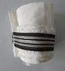 Catherine Osti White Linen with Stripe Trim Cuffs. 100% Unbleached Linen. Black & Silver stripe trim on base. Beaded Button top feature. Snap Closure. 19.5cm length snap to snap. 60g approximate weight, comes in white box. Made in France