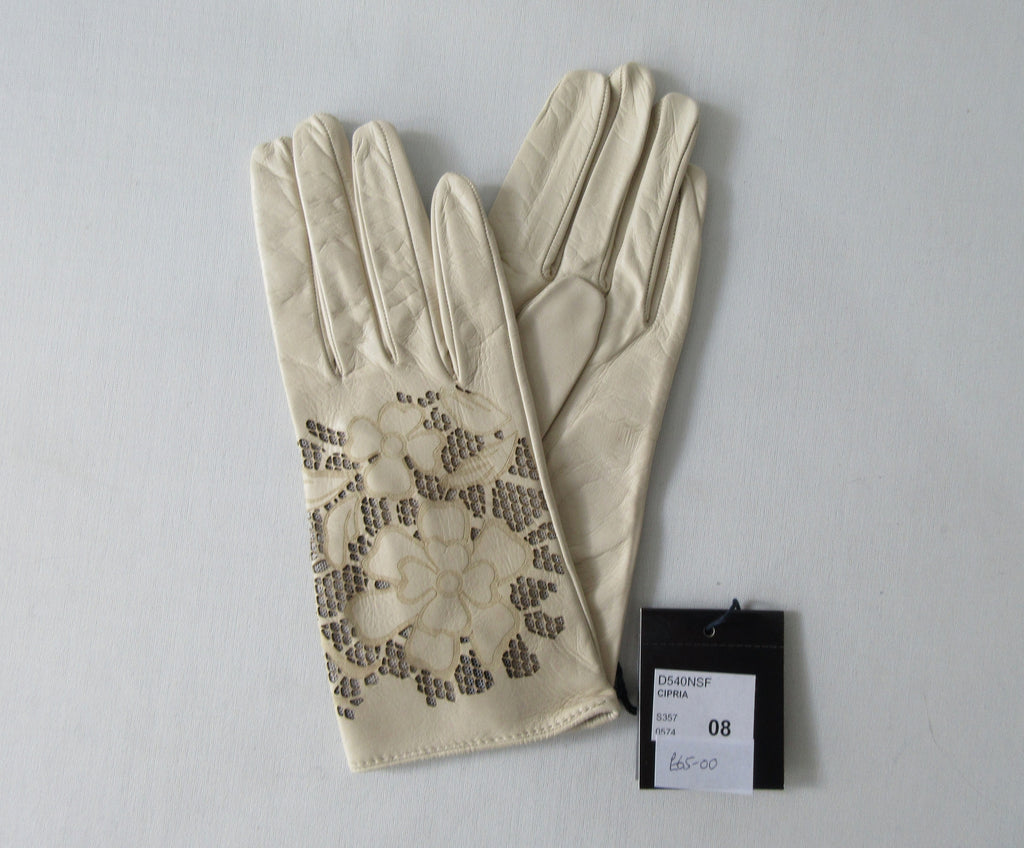 Beige Floral Cutout Gloves. Item Number D540NSF ICING 5358.0574. Beige Leather Gloves with floral cut-out design on top hand. Made in Italy. 60g approximate weight.